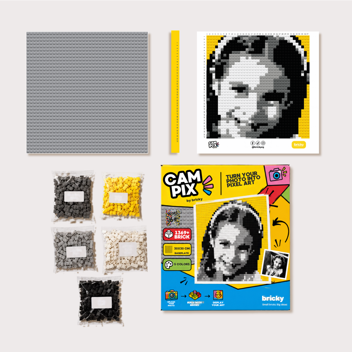 Bricky Cam Pix kit with printed guide, ruler, five color brick packs, and baseplate
